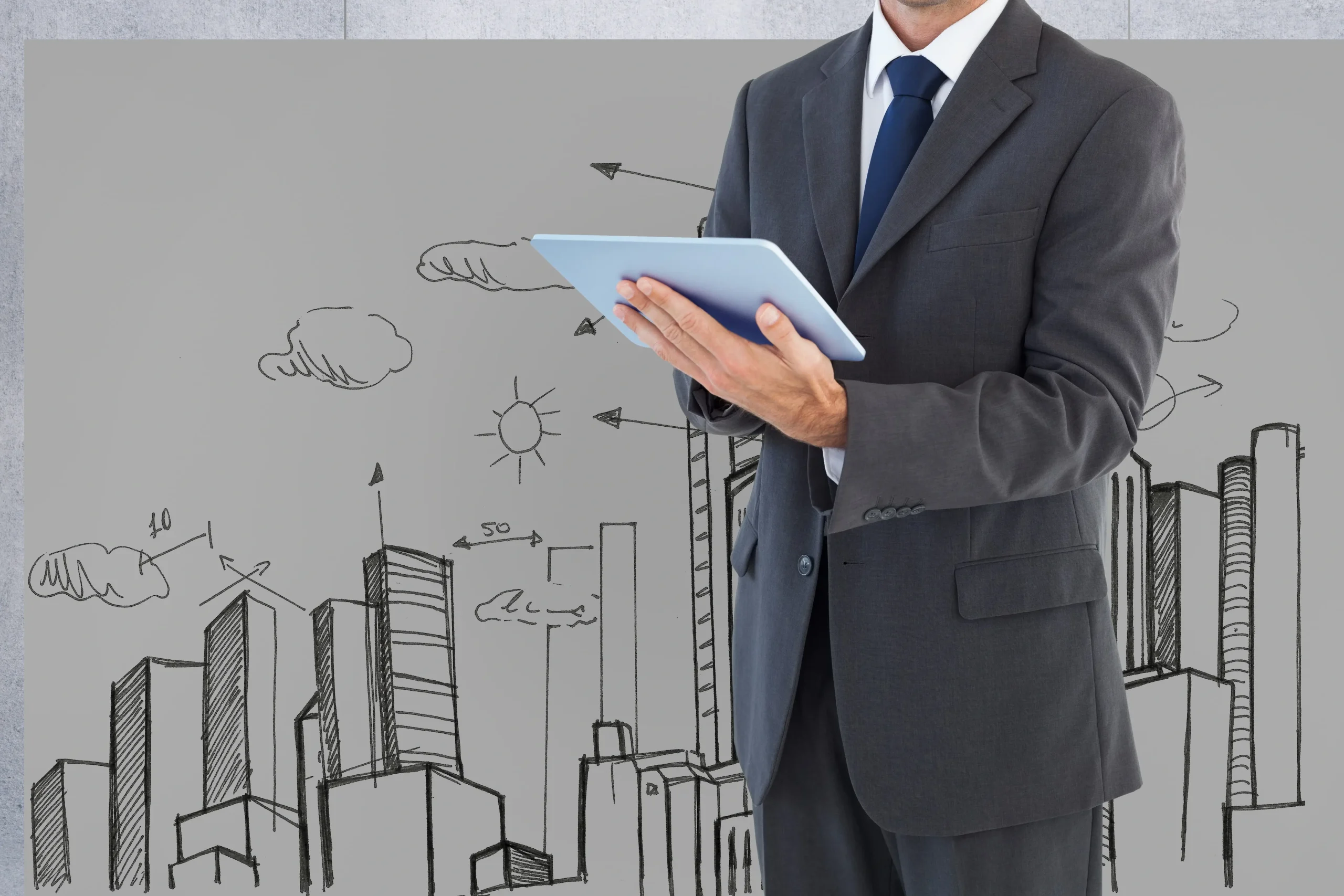 Man suit with tablet background city drawn min 1 scaled